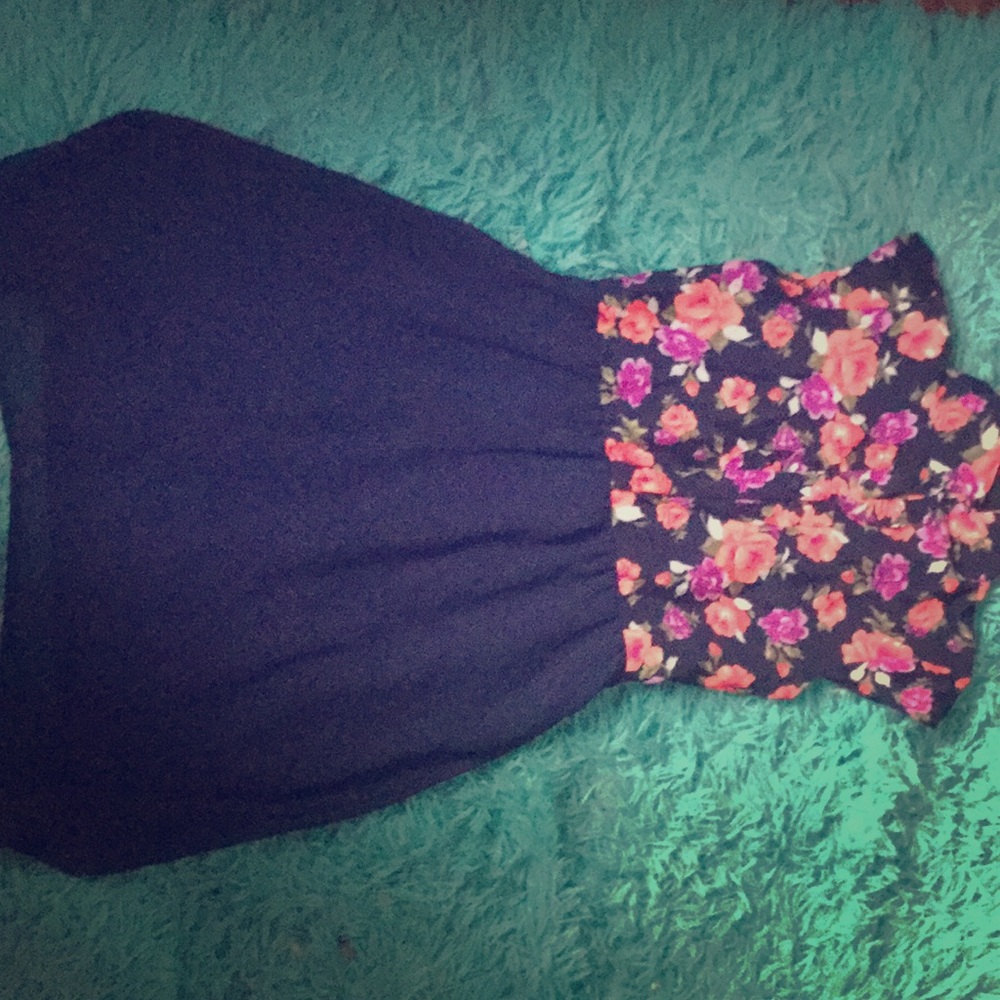 A blue flowered dress with buttons and a collar